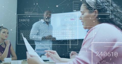 Businesswoman in headscarf leading data-driven team meeting with futuristic hud overlays