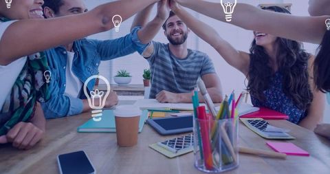 Diverse team collaborating and celebrating ideas concept