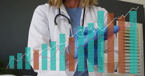 Doctor Analyzing Data with Medical Charts and Graphs in Clinic