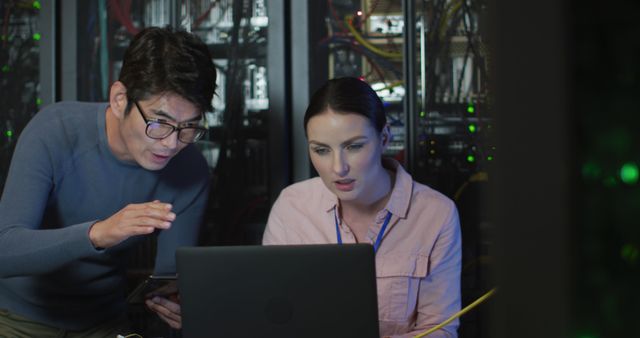 Two IT Professionals Collaborating in Server Room - Download Free Stock Photos Pikwizard.com