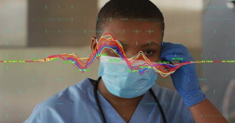 Nurse wearing mask and gloves with data visualization monitoring vital signs