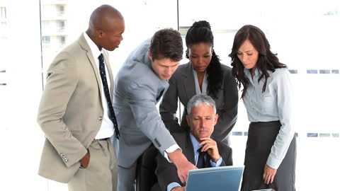 Diverse Team Engaged in Business Presentation Discussion