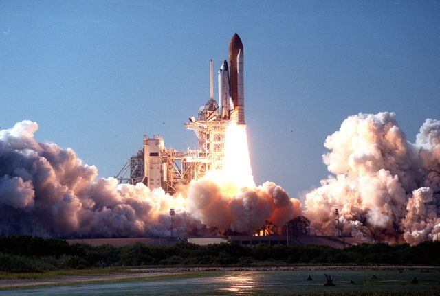 Space Shuttle Discovery blasting off from Launch Pad 39B at Cape Canaveral on October 29,1998, starting mission STS-95. Suitable for articles or projects on space exploration, NASA missions, aerospace engineering, and historical space events. Great for educational materials or displays about space travel processes and milestones.