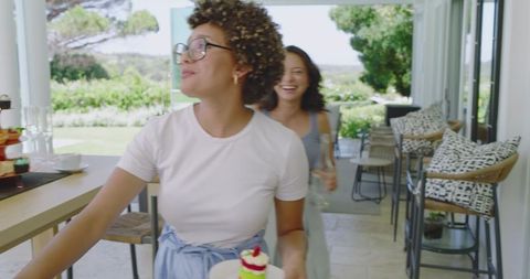 Joyful Brunch Gathering in Sunlit Garden Setting