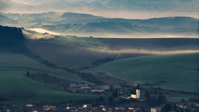 Tranquil Rural Valley with Church and Misty Hills at Sunrise - Download Free Stock Photos Pikwizard.com