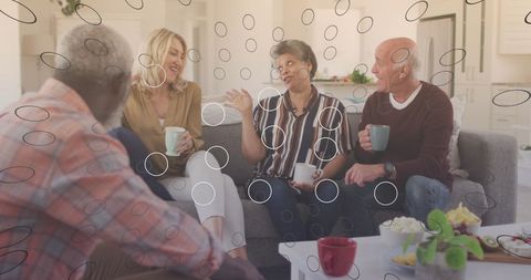 Diverse Seniors Engaged in Conversation with Digital Media Overlay