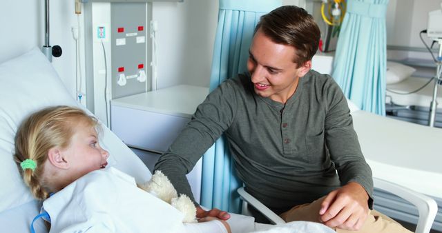 Man Visiting Child in Hospital, Sharing Compassionate Moment - Download Free Stock Images Pikwizard.com