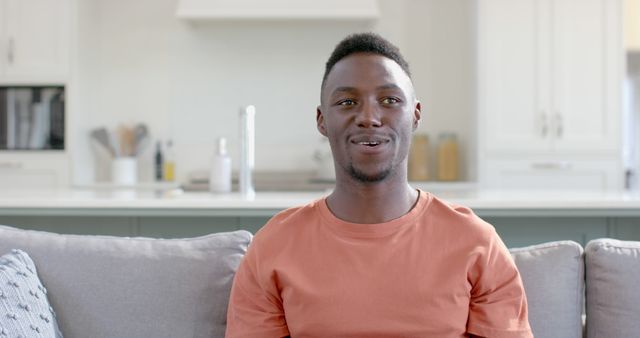 Smiling African American Man Relaxing on Couch at Home - Download Free Stock Images Pikwizard.com