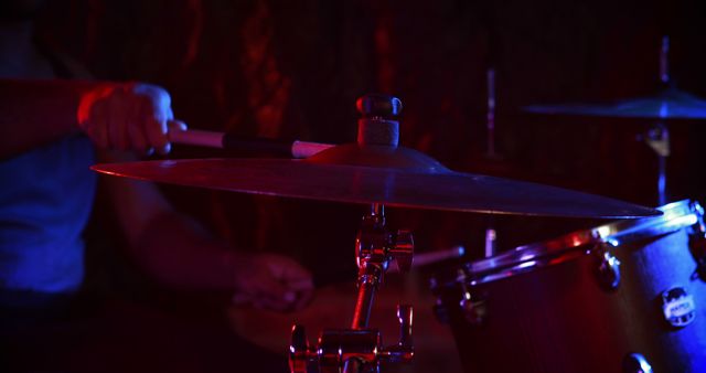Close-up of drummer playing on drum set at nightclub 4k