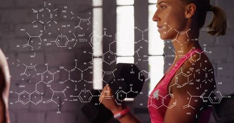 Focused woman lifting dumbbell in pink tank top with molecular chemistry fitness overlay