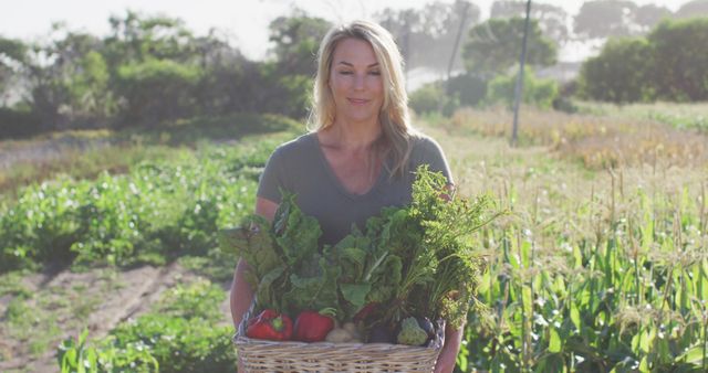 Smiling Woman Holding Basket of Fresh Vegetables on Farm - Download Free Stock Images Pikwizard.com