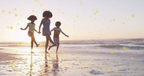 Joyful Family Running on Beach at Sunset - Download Free Stock Images Pikwizard.com