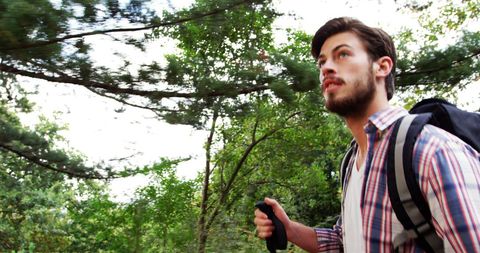Young Man Hiking Through Lush Forest Adventure Trek - Download Free Stock Images Pikwizard.com