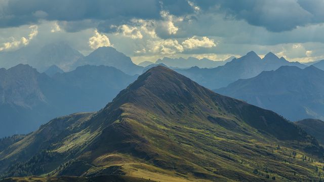 Scenic Mountain Range Under Dramatic Clouds - Download Free Stock Photos Pikwizard.com