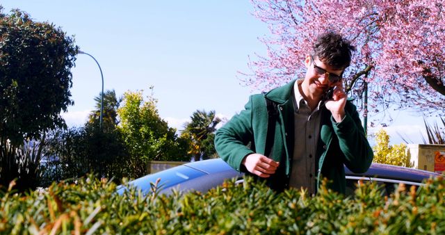 Man Having Phone Call Next to Car on Sunny Day - Download Free Stock Images Pikwizard.com