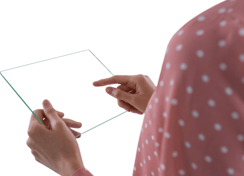 Person interacting with transparent glass tablet for futuristic concepts