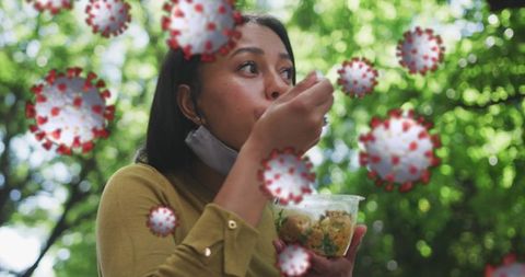 Woman Eating Lunch Surrounded by Abstract COVID-19 Influenza Virus Concept