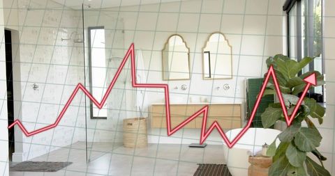 Upward trend line overlaying modern bathroom interior with freestanding tub and greenery