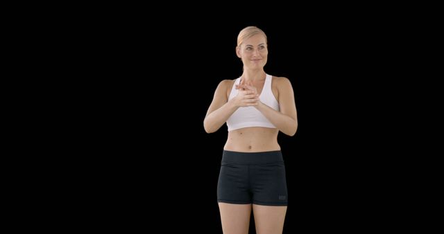 Athletic Woman in Sportswear Ready for Workout on Black Background - Download Free Stock Images Pikwizard.com