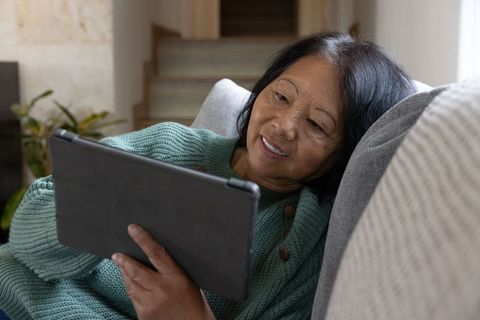 Senior Woman Enjoying Tablet Technology at Home