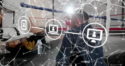Boxing coach instructing downed fighter in ring with digital network overlay
