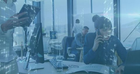 Team collaborating in open office using smartphone with city skyline digital overlay