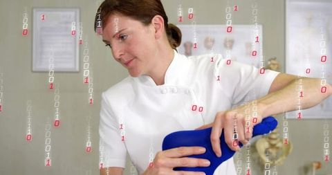 Physiotherapist holding blue ortho cushion during spinal assessment with digital overlay
