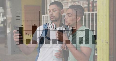 Young men checking smartphones with financial data and graph overlay on urban street scene