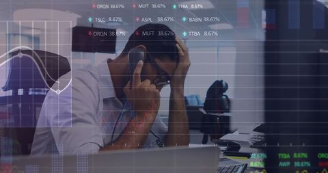Stressed businessman managing stock market crisis call