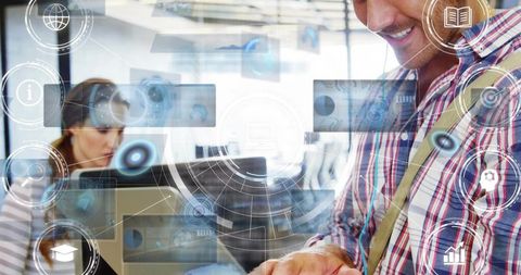 Man typing on laptop with augmented reality hud, colleagues collaborating for productivity