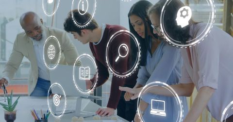 Diverse team collaborating with digital interface