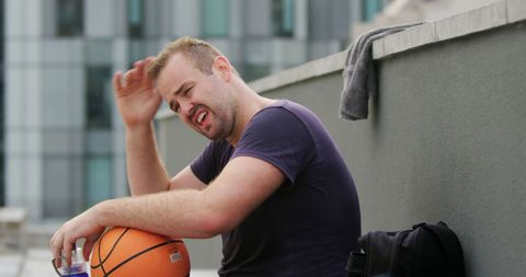 Tired Basketball Player Resting After Intense Game