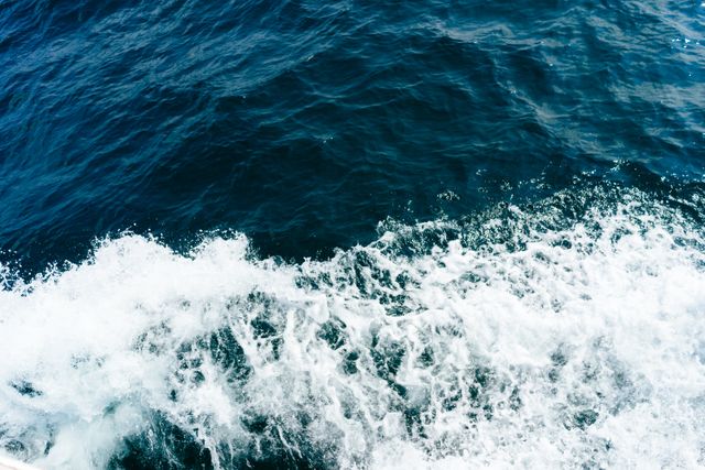 Waves Crashing Against Deep Blue Ocean Waters - Download Free Stock Photos Pikwizard.com