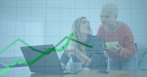 Businesswomen Analyzing Financial Growth with Graph Overlay