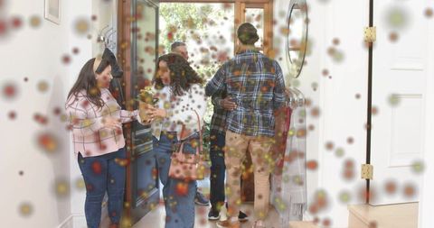 Friends and Family Greeting at Home Entryway Sharing Flowers and Hugs, Warm Welcome