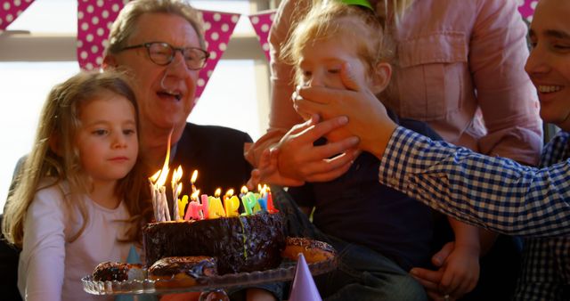 Joyful Family Birthday Celebration with Cake and Laughter - Download Free Stock Images Pikwizard.com