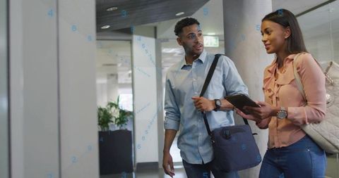 Business Colleagues Exploring Data Insights in Modern Office