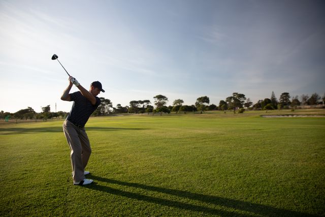 Male Golfer Practicing Swing on Sunny Golf Course - Download Free Stock Photos Pikwizard.com
