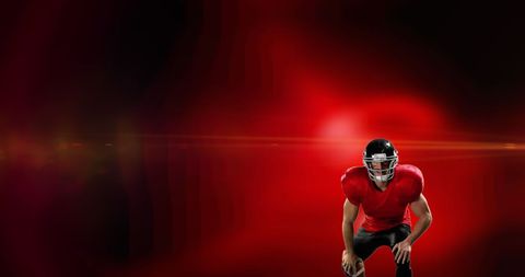 Dynamic American Football Player in Intense Red Lighting