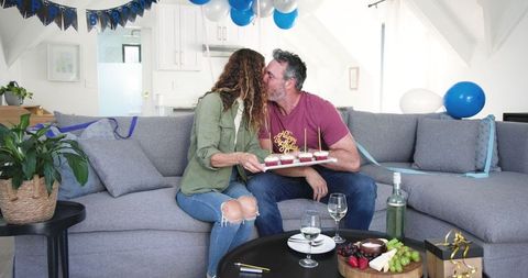 Couple Celebrates Birthday at Home with Wine and Decorations