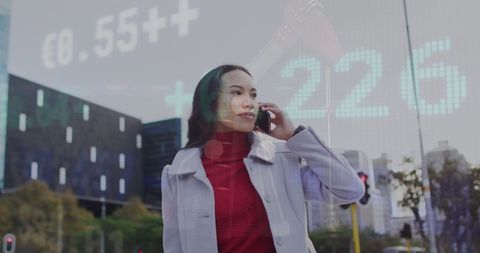 Businesswoman Analyzing Stock Market Trends on City Street