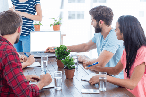 Collaborative Business Meeting with Transparent Laptop Screen - Download Free Stock Videos Pikwizard.com