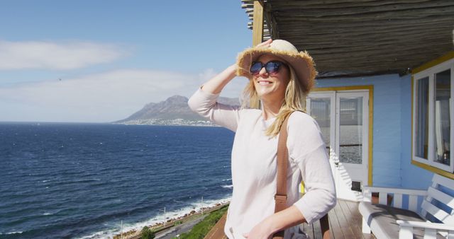 Happy Woman on Seaside Balcony Enjoying Sunny Day - Download Free Stock Images Pikwizard.com