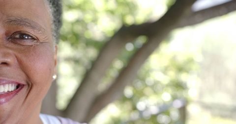 Happy Senior African American Woman Smiling in Nature