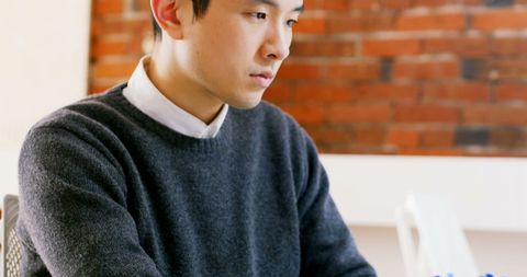 Focused Executive Working at Desk in Modern Industrial Office