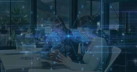 Collaborating professionals analyzing data on laptop with futuristic HUD overlay