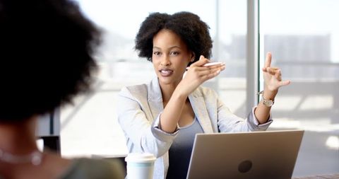 Diverse Female Professionals Engaging in Collaborative Discussion