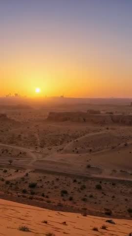 Sunrise Desert Solitude Vertical Video - Man in White Robe Watching Dawn from Sand Dune