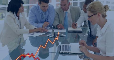 Diverse business meeting analyzing growth strategy data