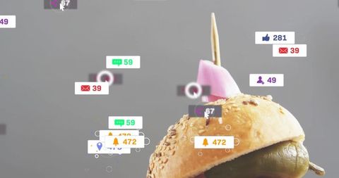 Sesame bun with olive and pink pick showing social media notification overlays